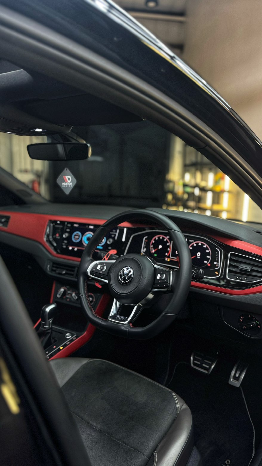 Volkswagen Polo GTI cockpit with red trim, cleaned steering wheel and detailed dashboard