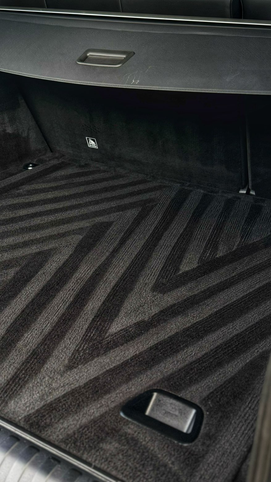 Close view of a deep cleaned boot carpet showing uniform pile lines and spotless trim